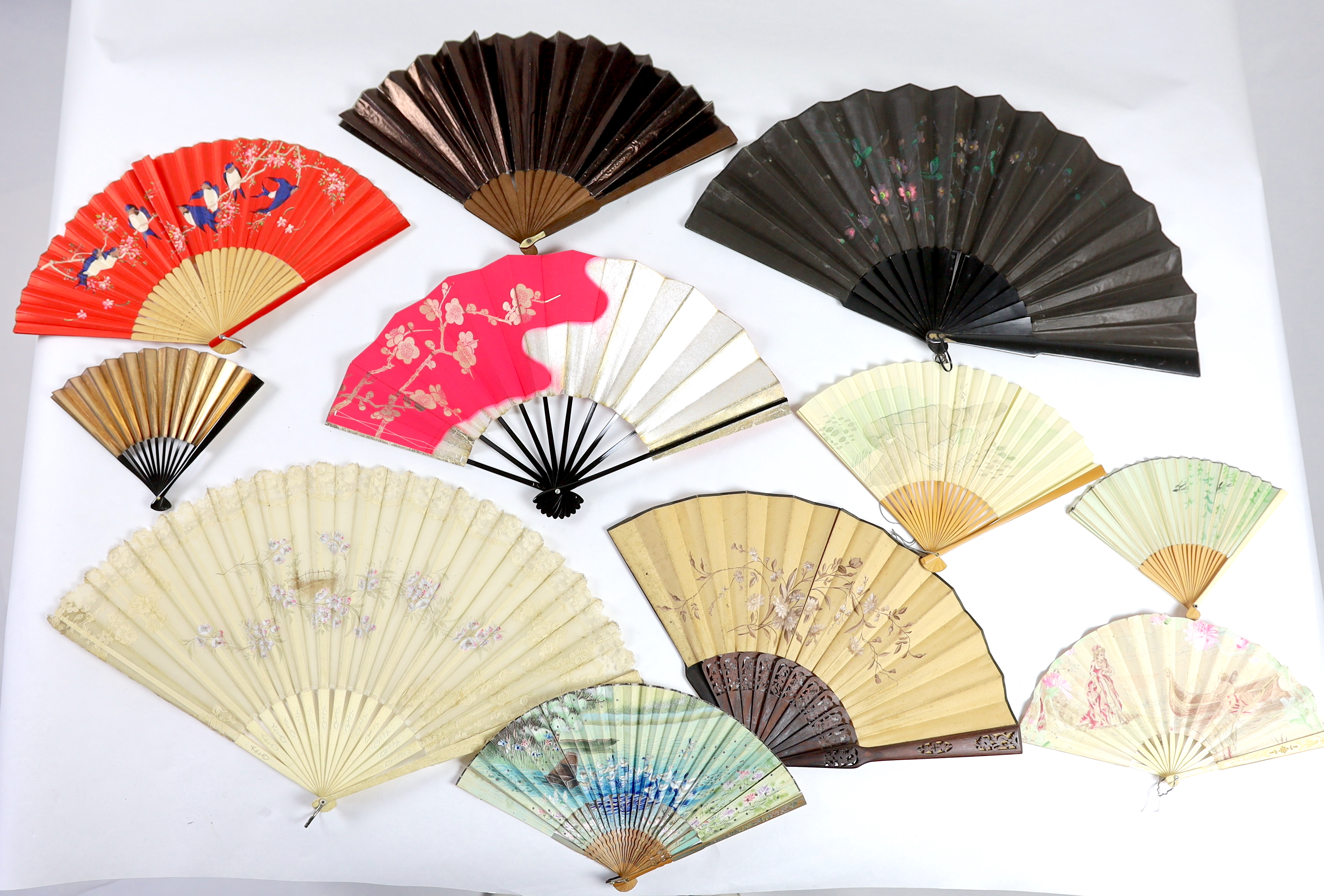 A collection of 19th and 20th century mostly paper fans, ten in reasonable condition useful for stage and film (16)